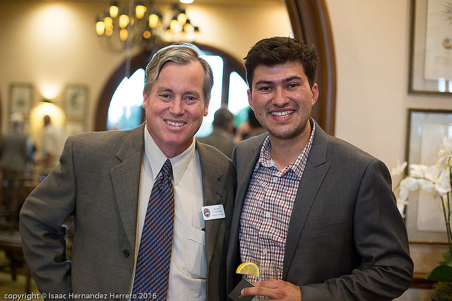 Board of Directors Chair Barrett O'Gorman and student speaker John Unzueta.
